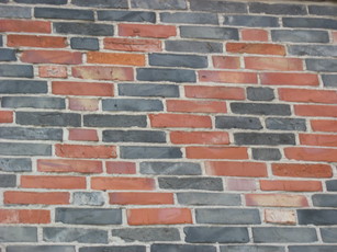wall with 'XO' written by bricks